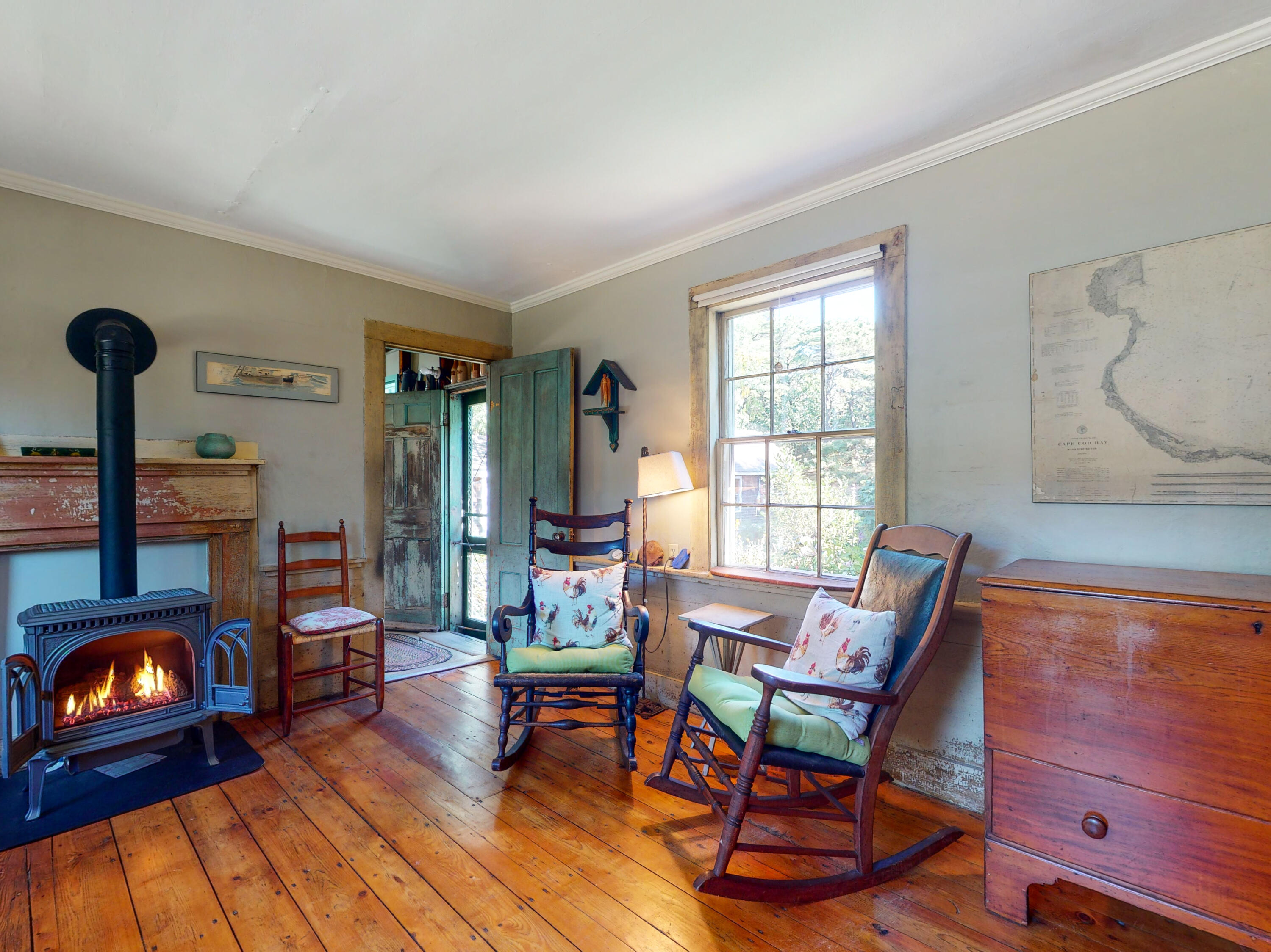 115 Cove Road Wellfleet, MA 02667 - Photo 12 of 49 a living room with furniture and a fireplace