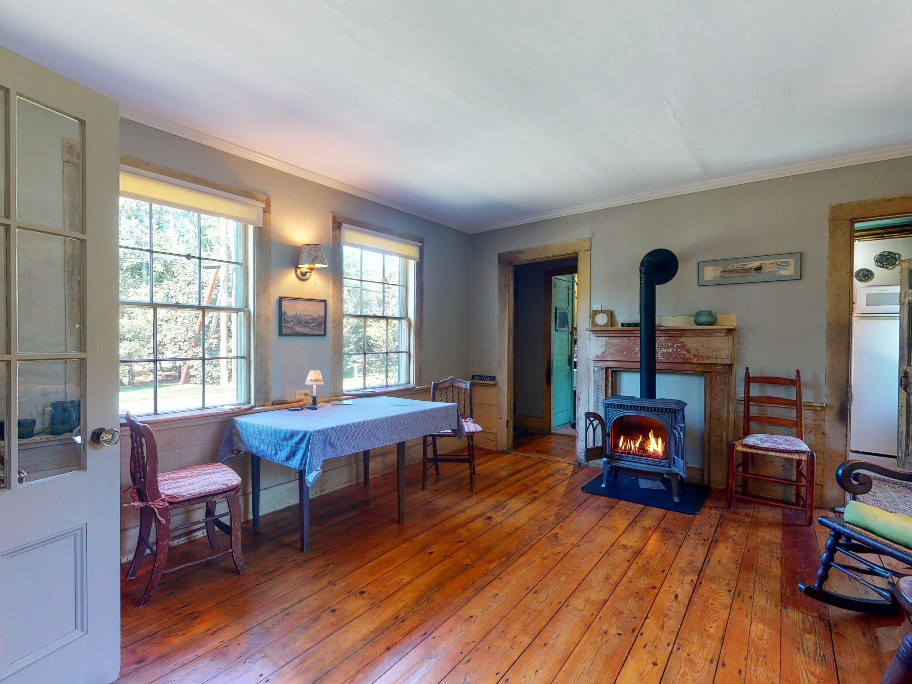 115 Cove Road Wellfleet, MA 02667 - Photo 15 of 49 a living room with furniture and a fireplace