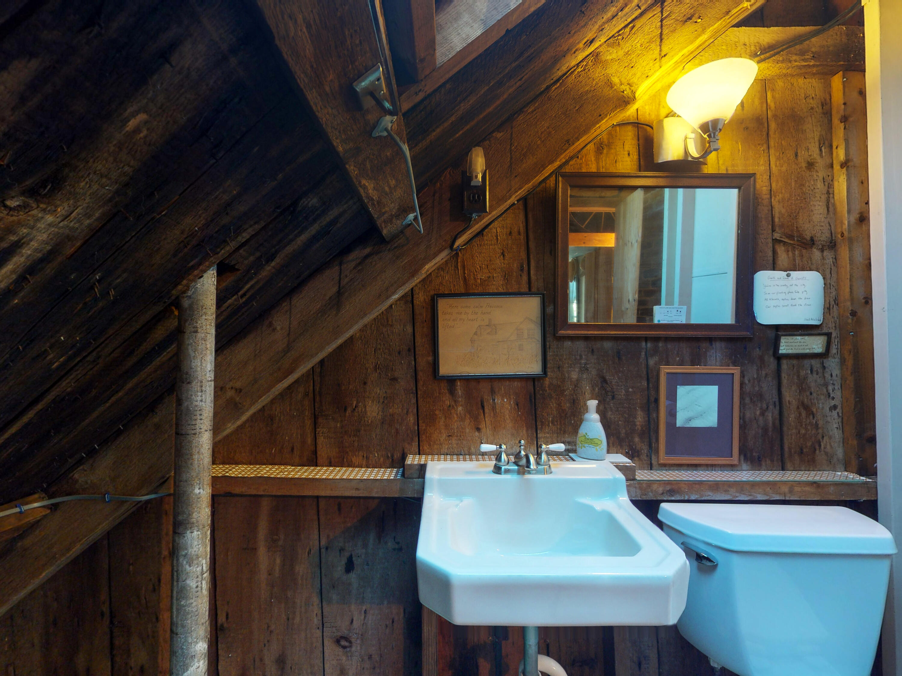 115 Cove Road Wellfleet, MA 02667 - Photo 26 of 49 a bathroom with a sink and mirror