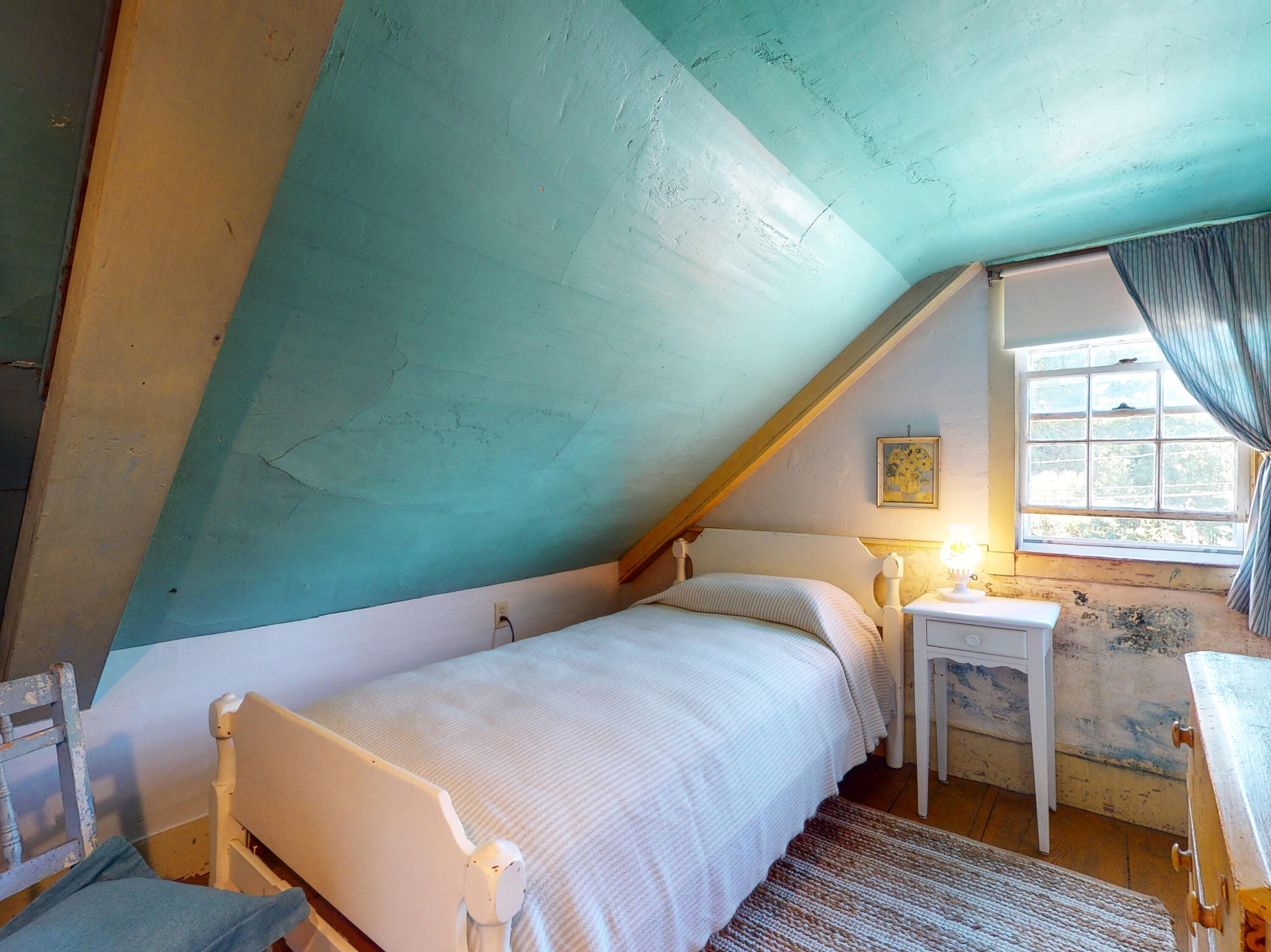 115 Cove Road Wellfleet, MA 02667 - Photo 27 of 49 a bedroom with a bed and wooden floor