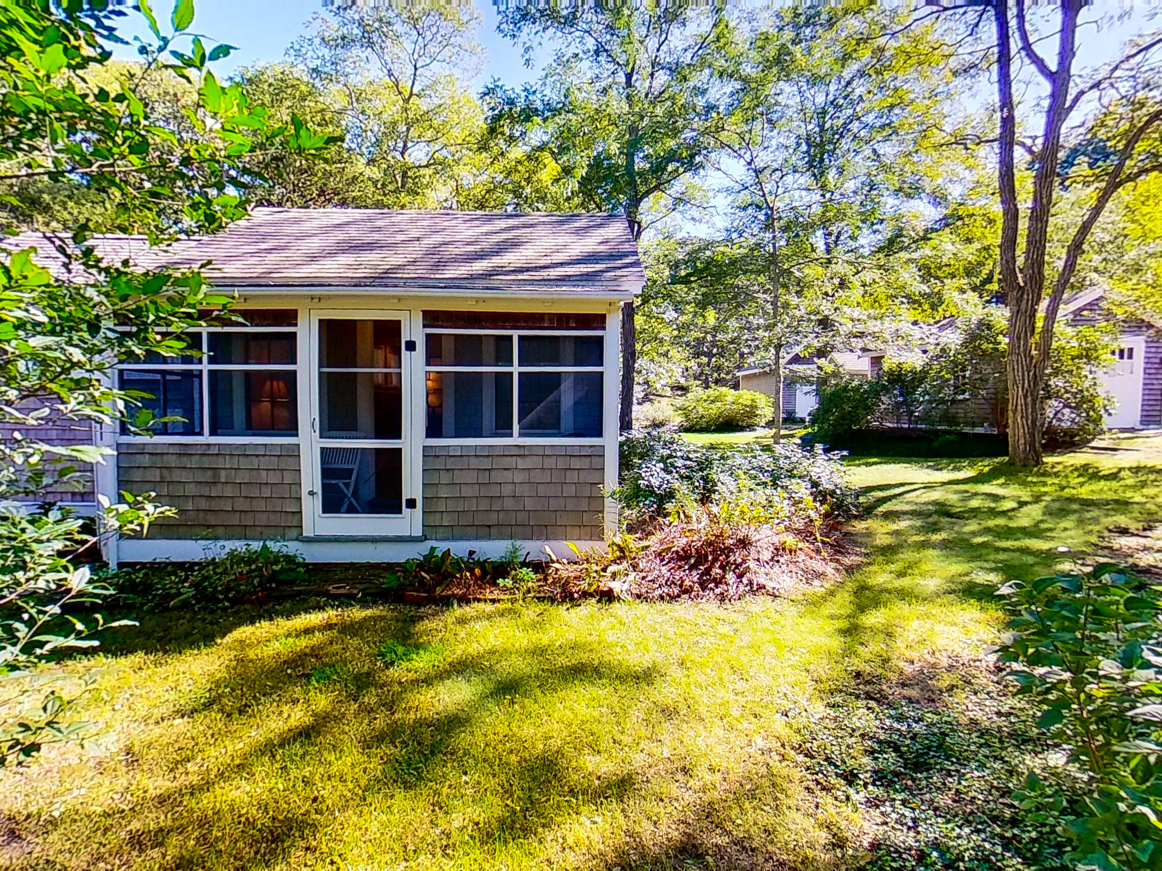 115 Cove Road Wellfleet, MA 02667 - Photo 32 of 49 a view of brick house with a yard