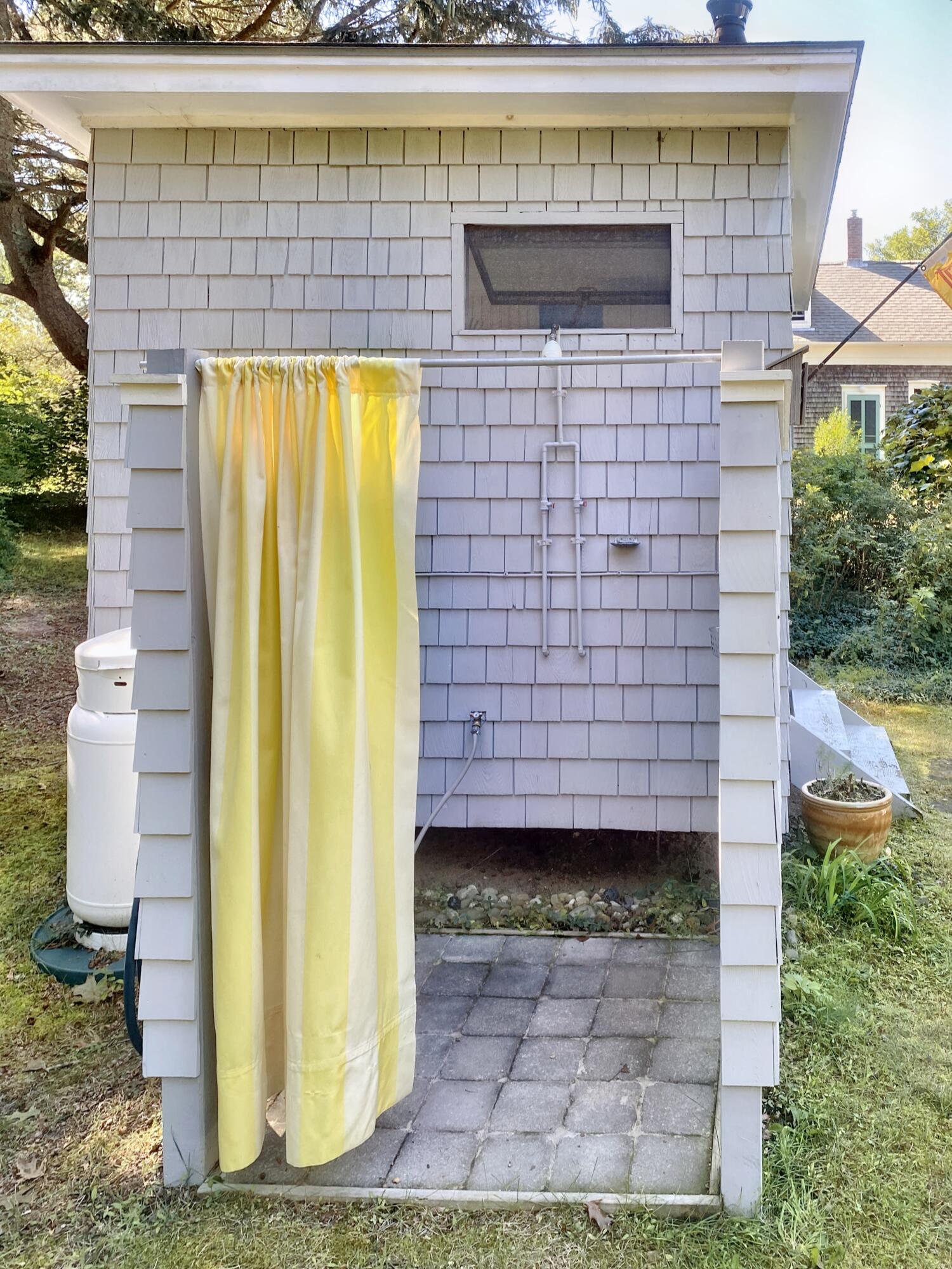 115 Cove Road Wellfleet, MA 02667 - Photo 43 of 49 a view of a door of the house with a outdoor seating