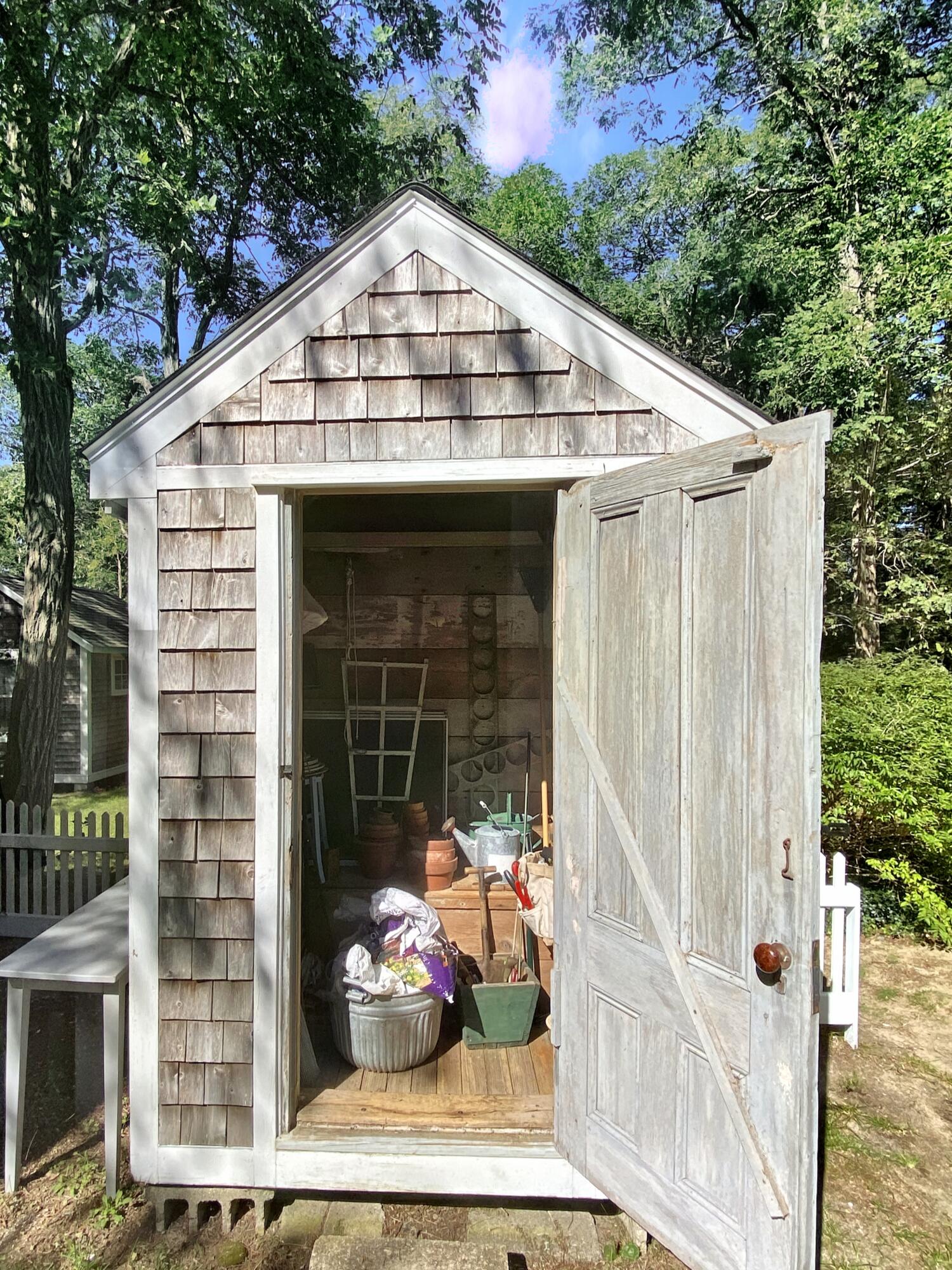 115 Cove Road Wellfleet, MA 02667 - Photo 44 of 49 a view of a small house with potted plants