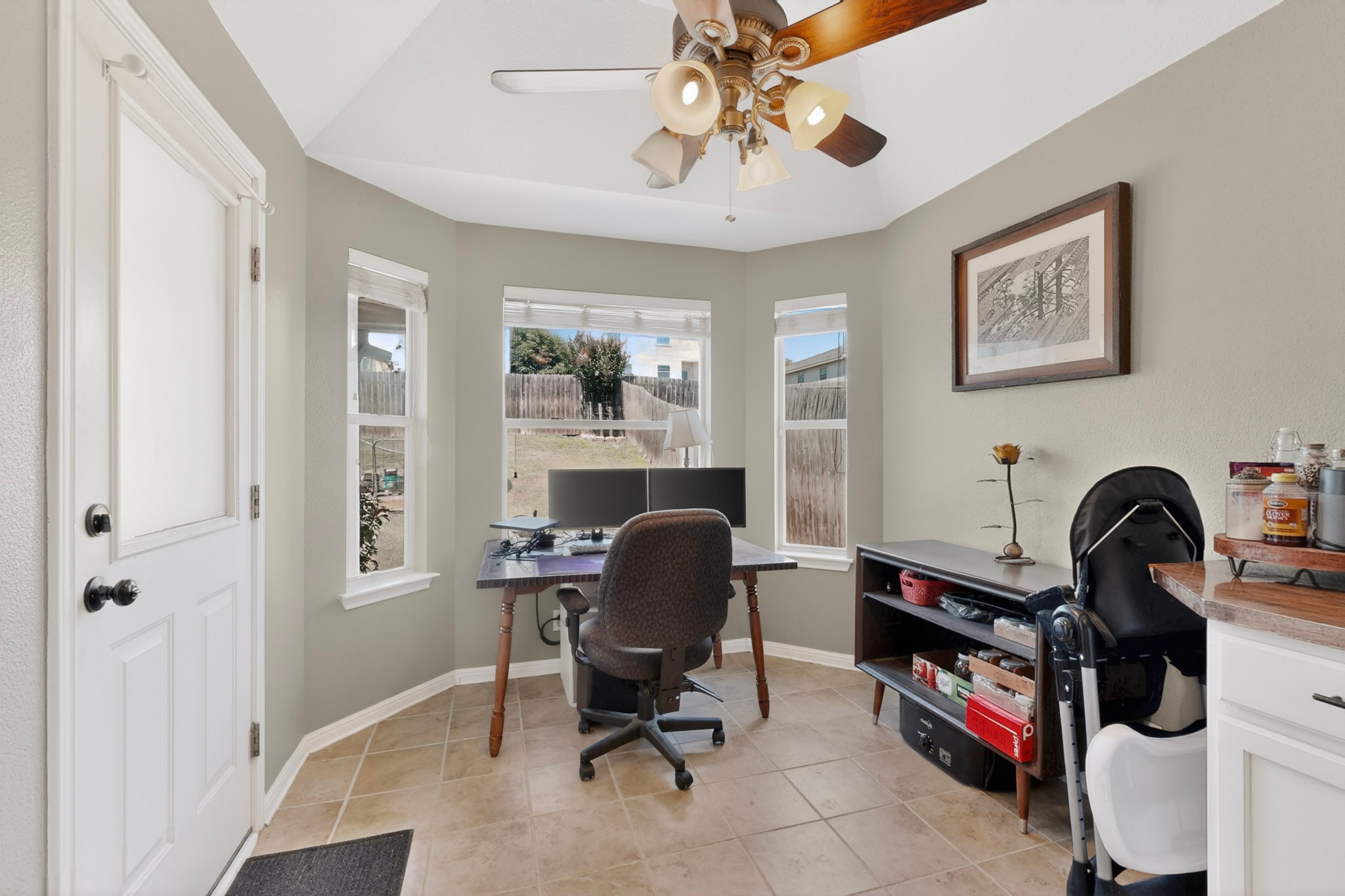 15104 Mimebark Way Austin, TX 78724 - Photo 16 of 38 Bay window area with beige tile flooring and a vaulted ceiling