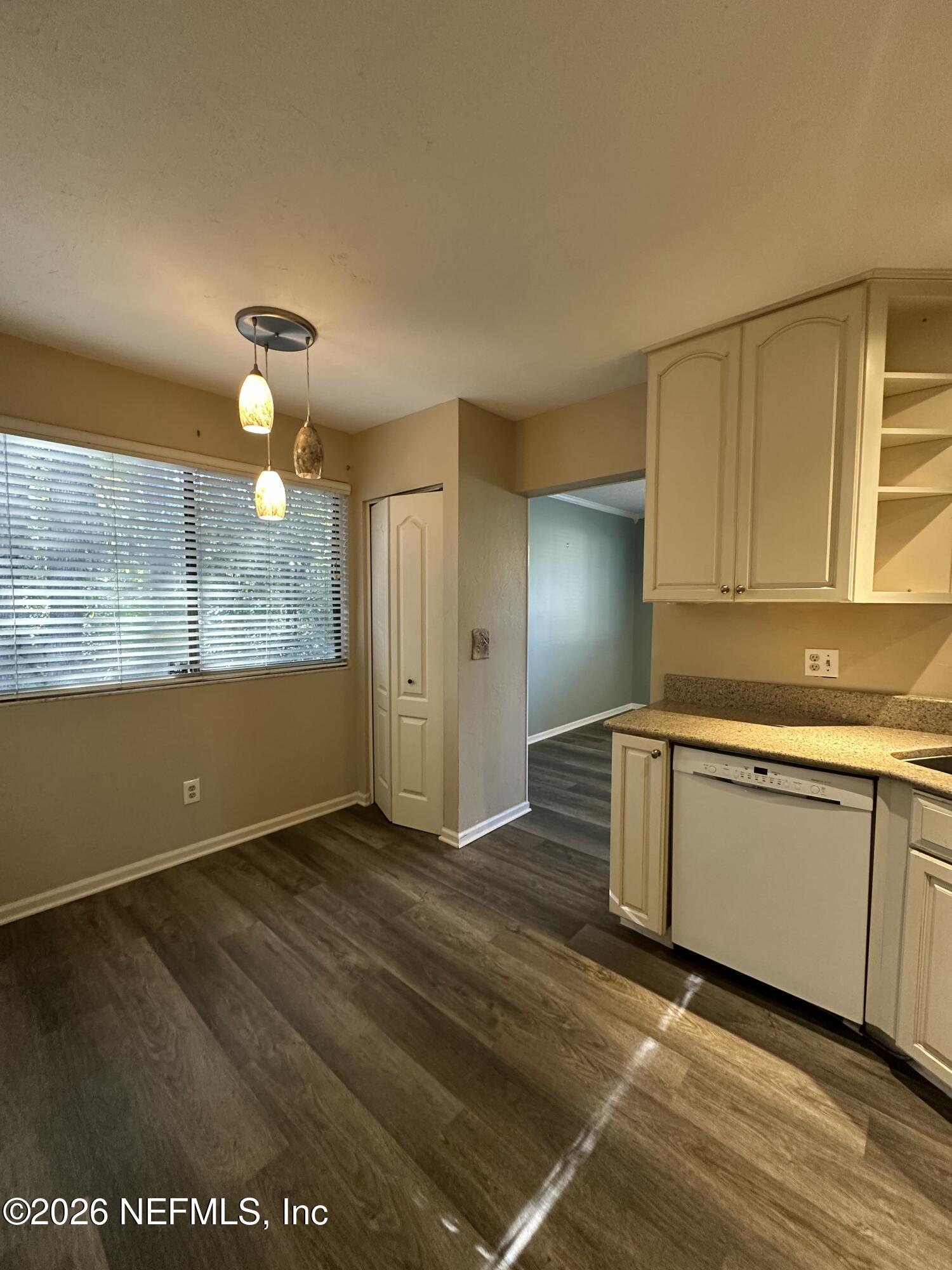 3801 Crown Point Road, Unit 3081 Jacksonville, FL 32257 - Photo 11 of 34 a view of an empty room with window and wooden floor