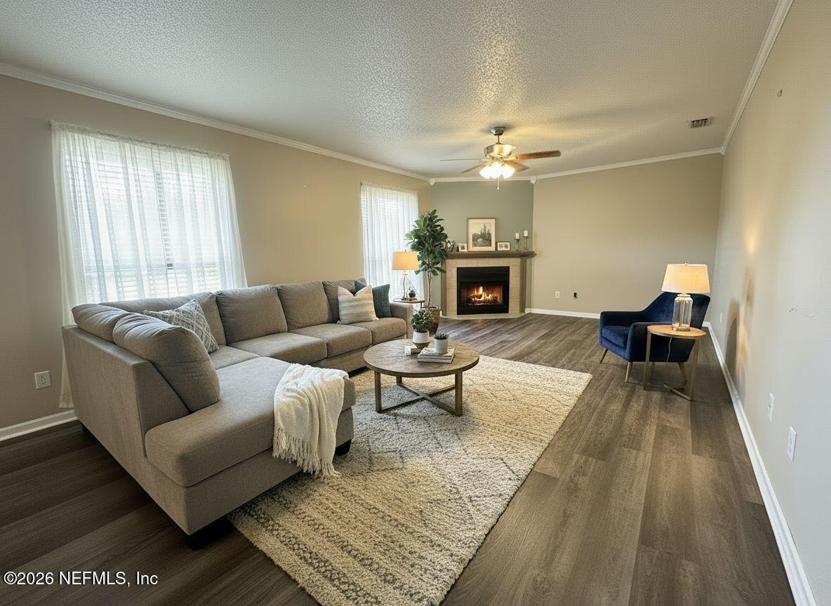 3801 Crown Point Road, Unit 3081 Jacksonville, FL 32257 - Photo 15 of 34 a living room with furniture and a fireplace
