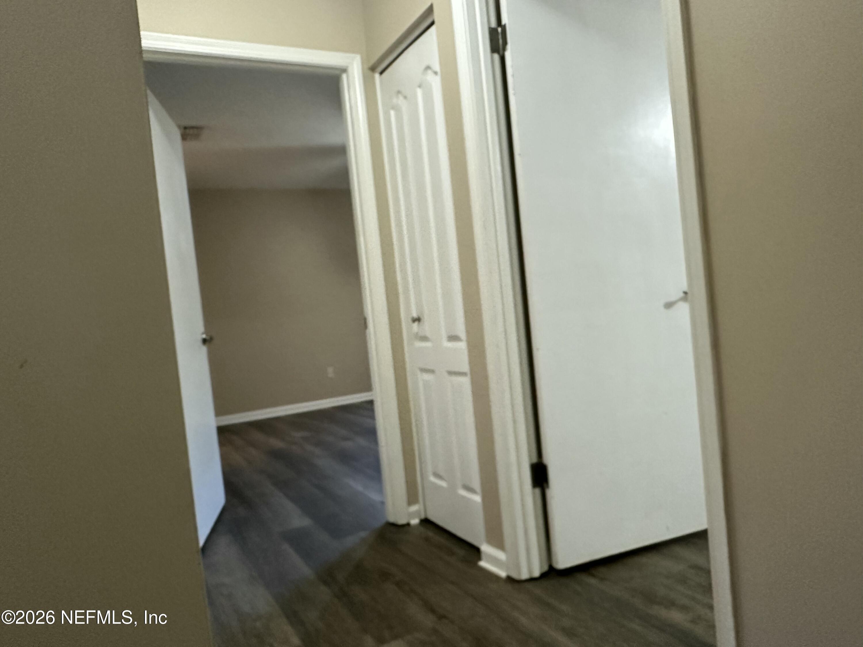 3801 Crown Point Road, Unit 3081 Jacksonville, FL 32257 - Photo 22 of 34 an entryway with wooden floor and entrance