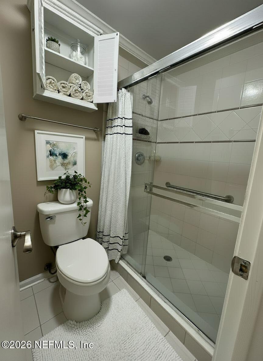 3801 Crown Point Road, Unit 3081 Jacksonville, FL 32257 - Photo 27 of 34 a bathroom with a toilet and a shower