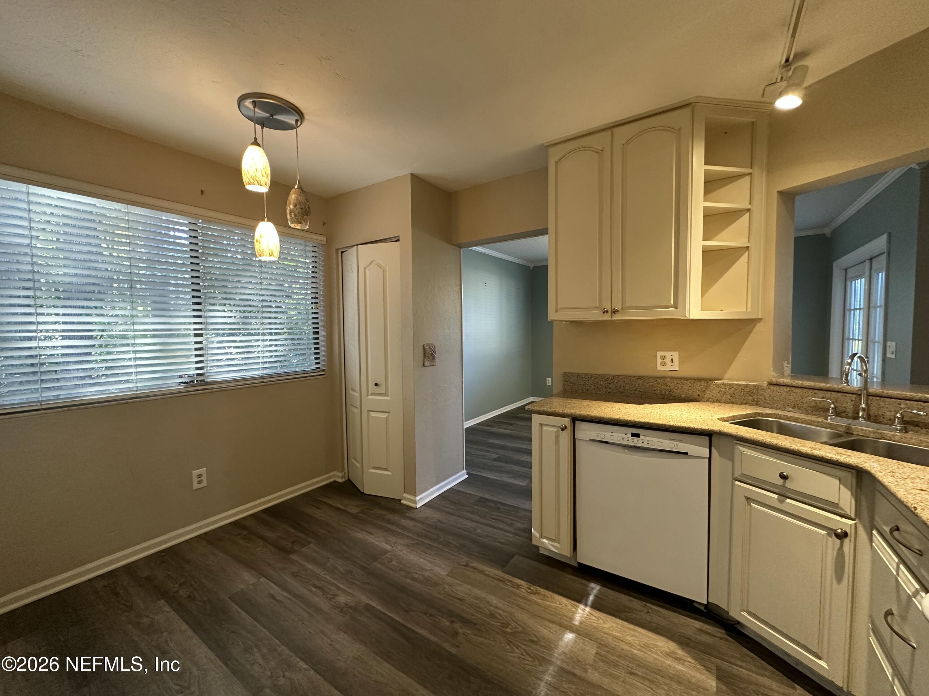 3801 Crown Point Road, Unit 3081 Jacksonville, FL 32257 - Photo 10 of 34 a kitchen with a sink cabinets and wooden floor