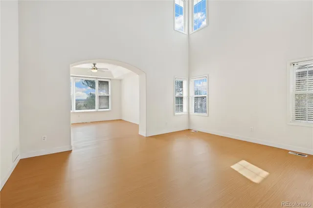 a view of a room with a ceiling fan