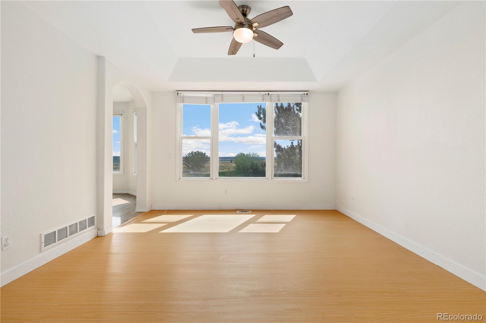 5662 South Nome Street Englewood, CO 80111 - Photo 14 of 47 a view of an empty room with a window