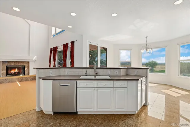 a view of an empty room with a fireplace