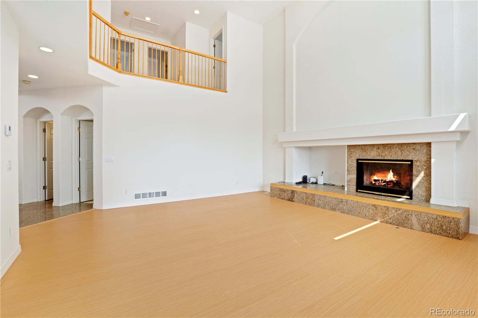 5662 South Nome Street Englewood, CO 80111 - Photo 21 of 47 a view of an empty room with a fireplace