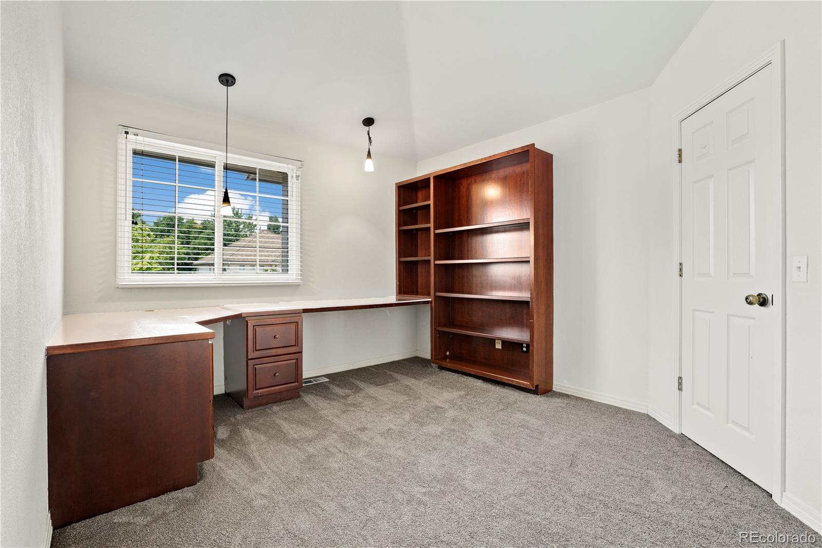 5662 South Nome Street Englewood, CO 80111 - Photo 29 of 47 a view of workspace with furniture and window