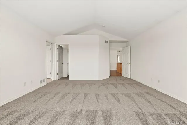 a spacious bathroom with a granite countertop tub sink and mirror