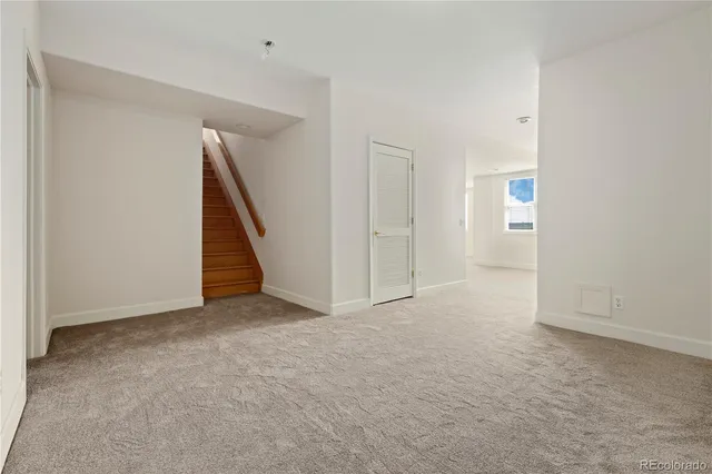 a kitchen with a cabinets and white appliances
