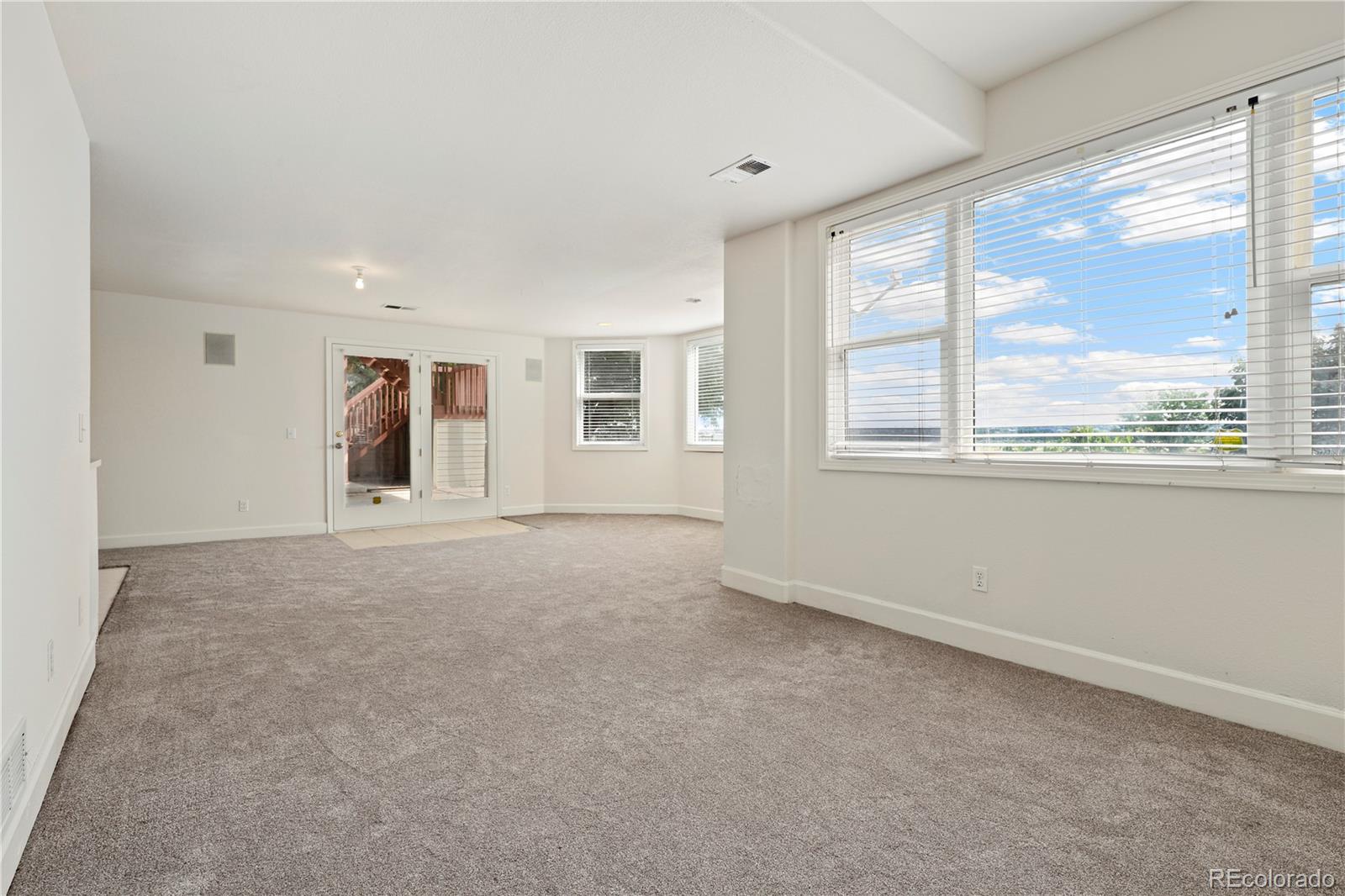 5662 South Nome Street Englewood, CO 80111 - Photo 38 of 47 a view of an empty room with a window