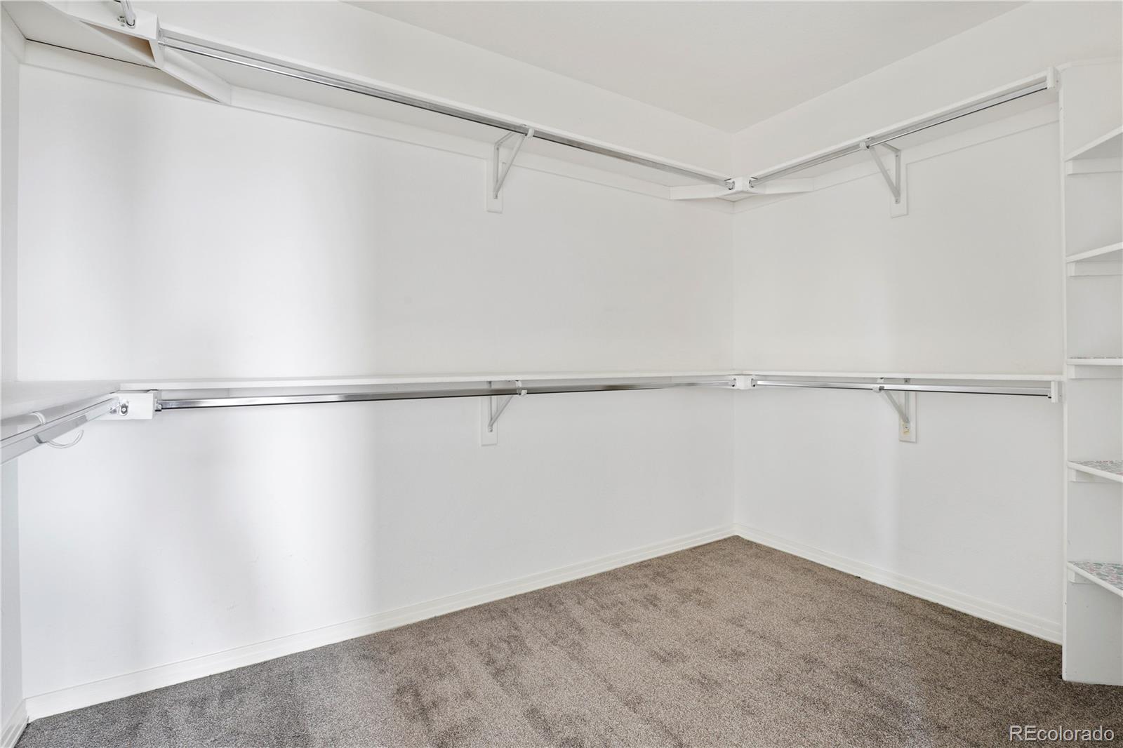 5662 South Nome Street Englewood, CO 80111 - Photo 47 of 47 a view of an empty walk in closet