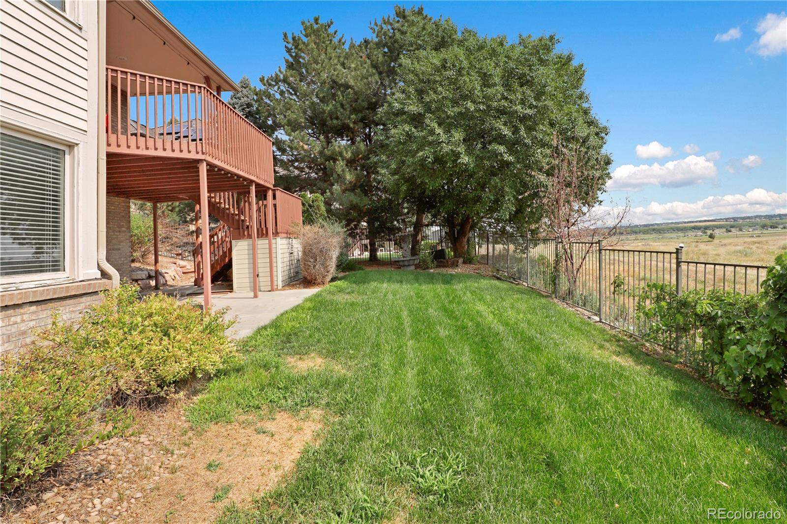 5662 South Nome Street Englewood, CO 80111 - Photo 5 of 47 a view of a house with backyard and sitting area