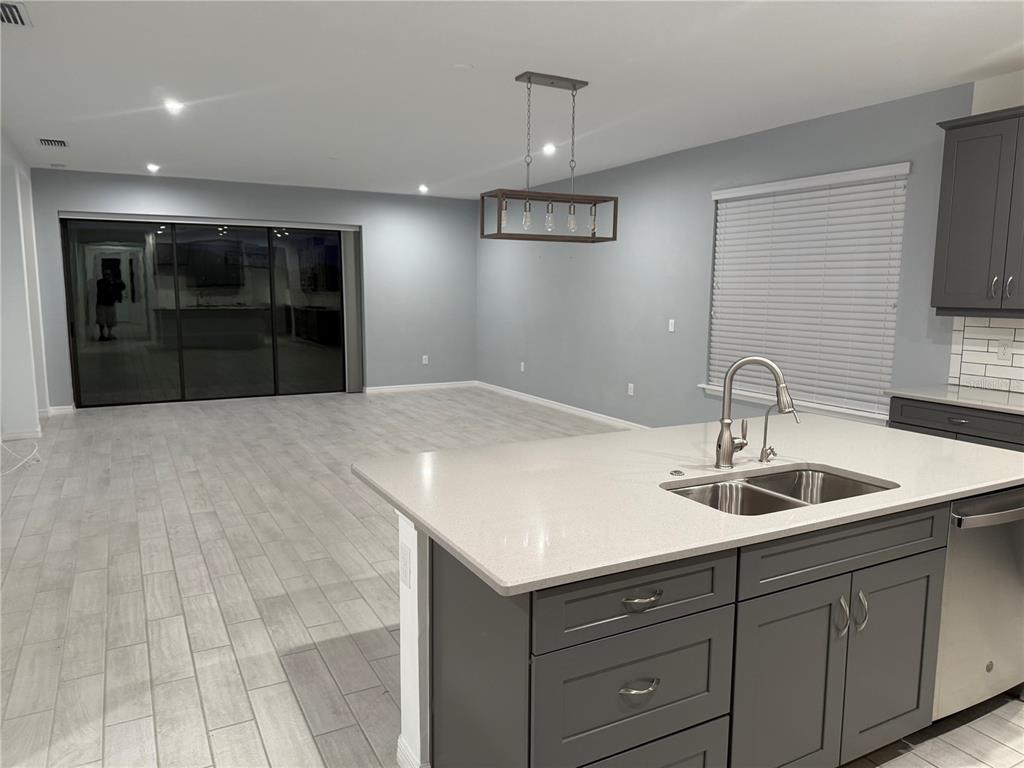 9291 Starry Night Avenue Sarasota, FL 34241 - Photo 12 of 30 a kitchen with a sink and cabinets