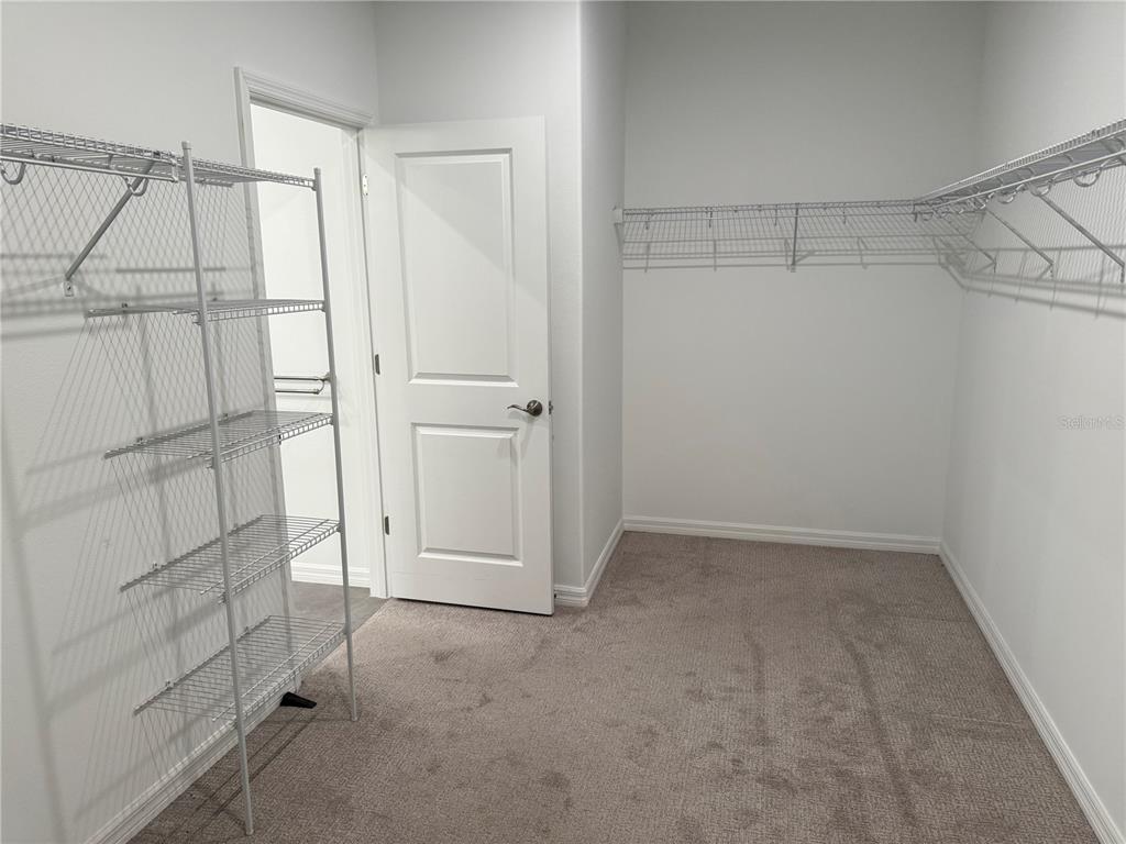 9291 Starry Night Avenue Sarasota, FL 34241 - Photo 16 of 30 a view of walk in closet