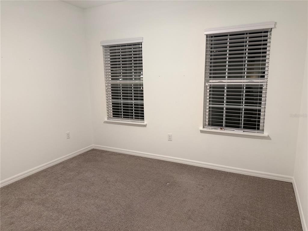 9291 Starry Night Avenue Sarasota, FL 34241 - Photo 18 of 30 a view of empty room with windows