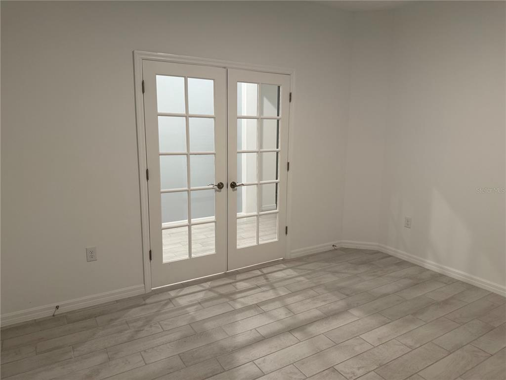 9291 Starry Night Avenue Sarasota, FL 34241 - Photo 21 of 30 an empty room with windows