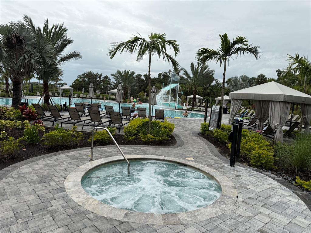 9291 Starry Night Avenue Sarasota, FL 34241 - Photo 24 of 30 a view of a backyard with swimming pool and furniture