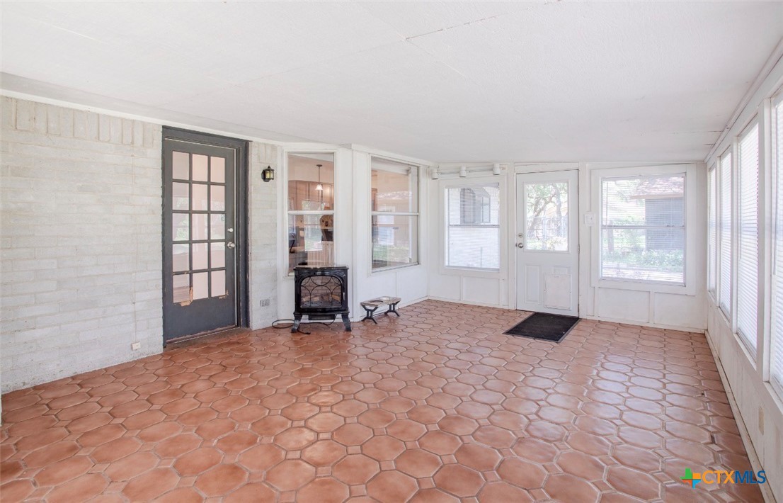 188 Cavalry Road Victoria, TX 77905 - Photo 18 of 30 wooden floor in an empty room with a window