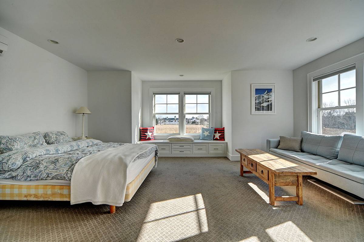 63 Newlight Lane Bridgehampton, NY 11976 - Photo 33 of 37 a bed room with furniture and a window
