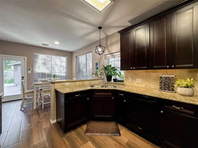 a kitchen with a sink and cabinets