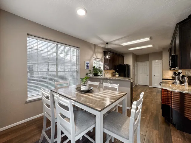 a view of a dining room with furniture