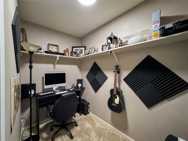 a bedroom with a workspace