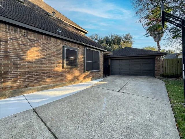 a view of backyard with large trees