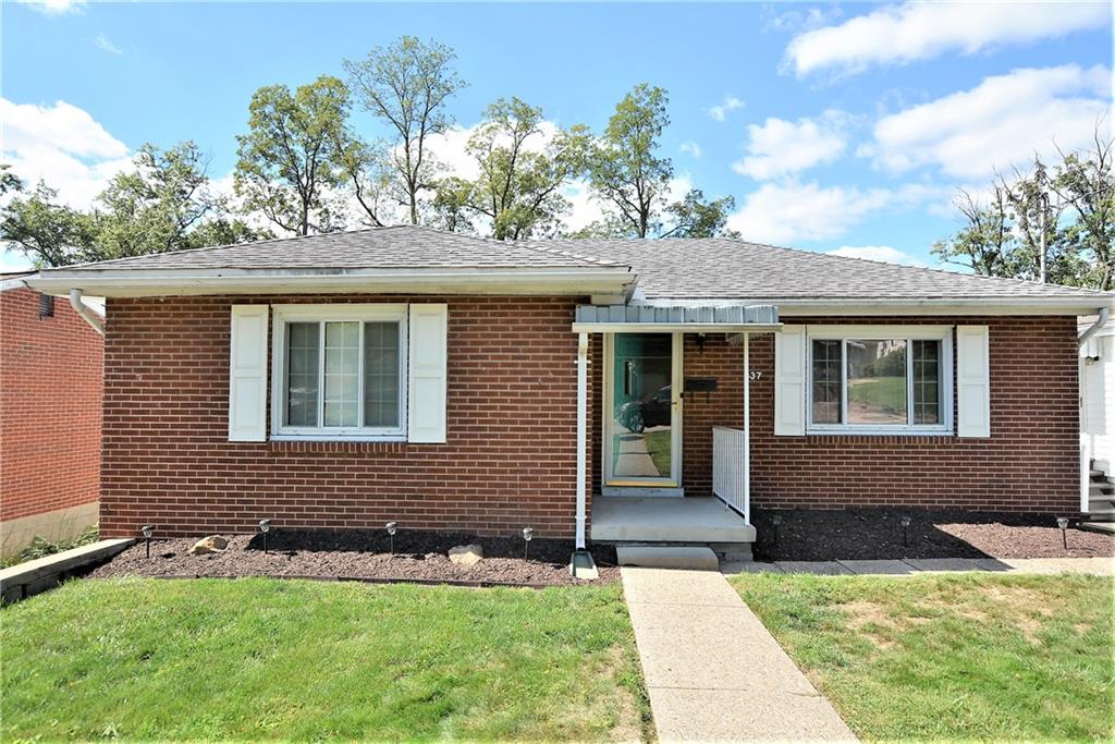 437 Greenridge Road New Kensington, PA 15068 - Photo 1 of 25 a front view of a house with a yard