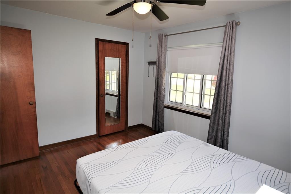 437 Greenridge Road New Kensington, PA 15068 - Photo 12 of 25 a bedroom with a bed and wooden floor