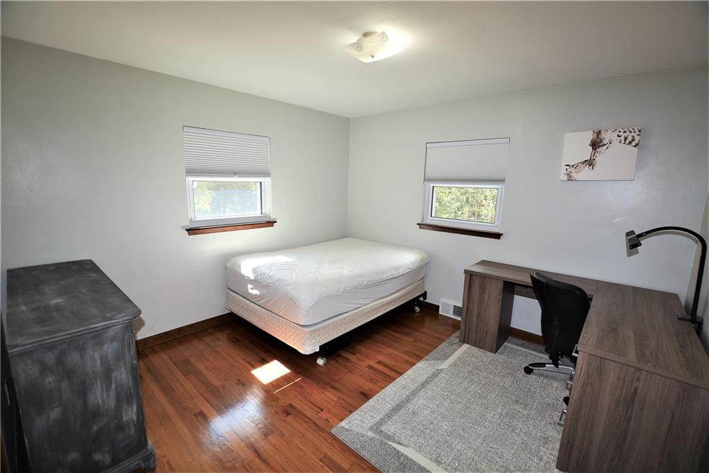 437 Greenridge Road New Kensington, PA 15068 - Photo 15 of 25 a bedroom with a bed and a desk