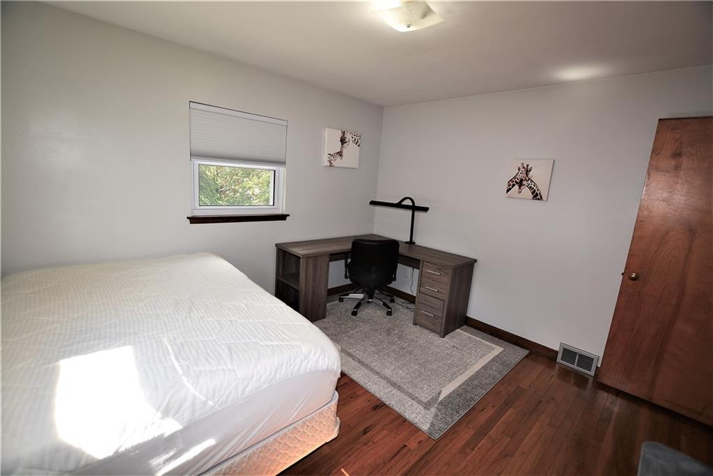 437 Greenridge Road New Kensington, PA 15068 - Photo 16 of 25 a bedroom with a bed and a desk