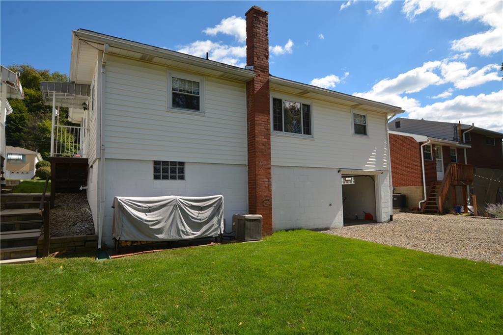 437 Greenridge Road New Kensington, PA 15068 - Photo 21 of 25 a front view of a house with garden