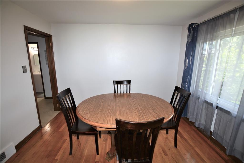 437 Greenridge Road New Kensington, PA 15068 - Photo 8 of 25 a view of a dining room with furniture and wooden floor
