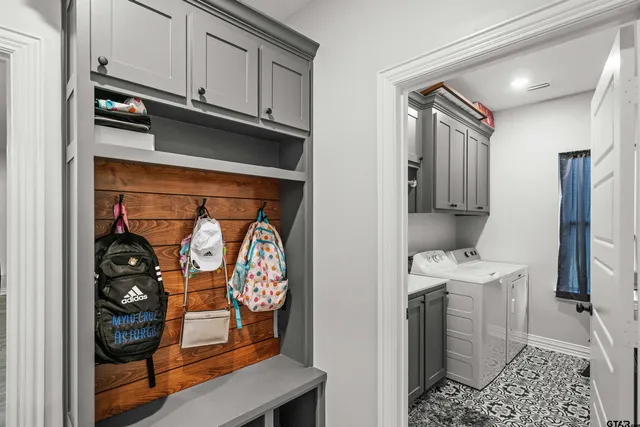 a view of storage and utility room with washer and dryer