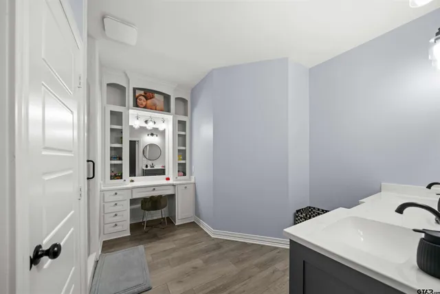 a view of a kitchen cabinets and wooden floor