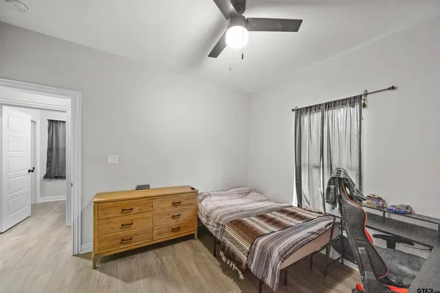 a bedroom with a bed and a dresser