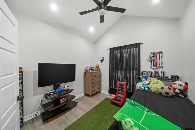 a children room with toys and a flat screen tv