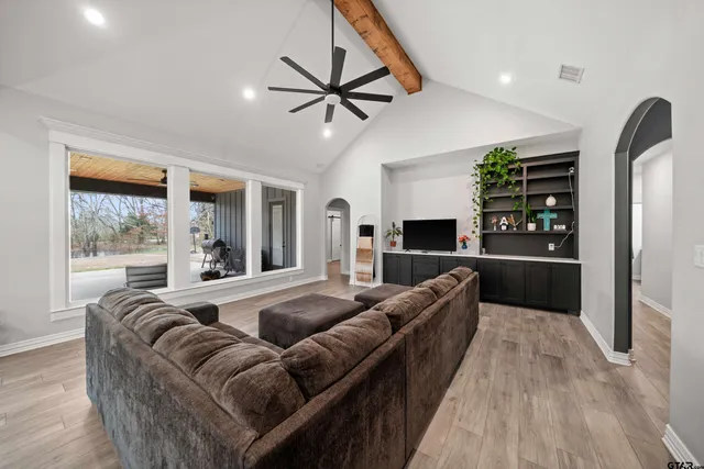 a living room with furniture and a fireplace