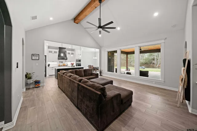 a living room with furniture and a large window