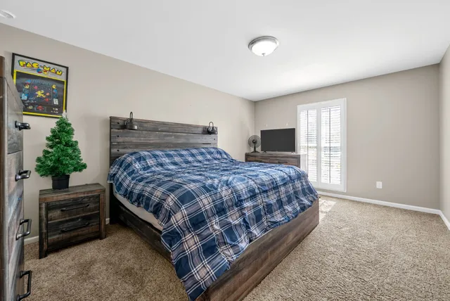 a bedroom with a bed and a closet