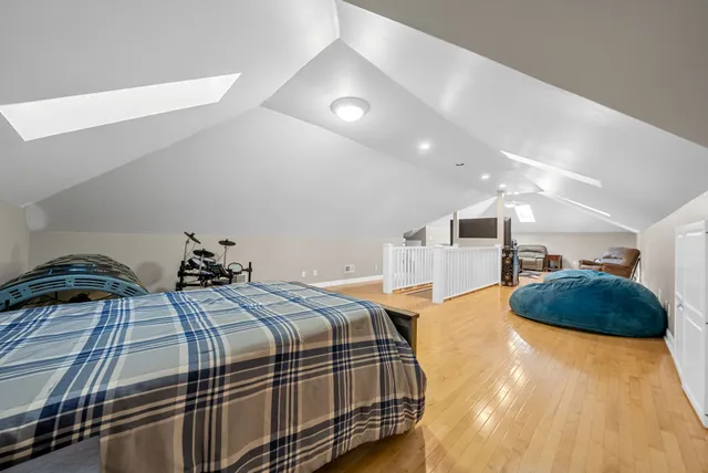 a view of a room with wooden floor