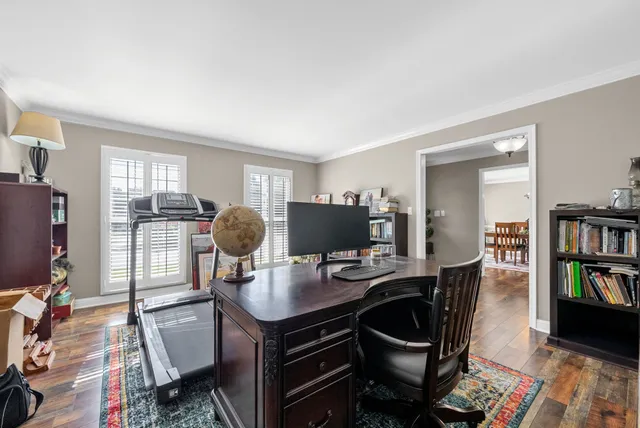 a view of a room with workspace and a window