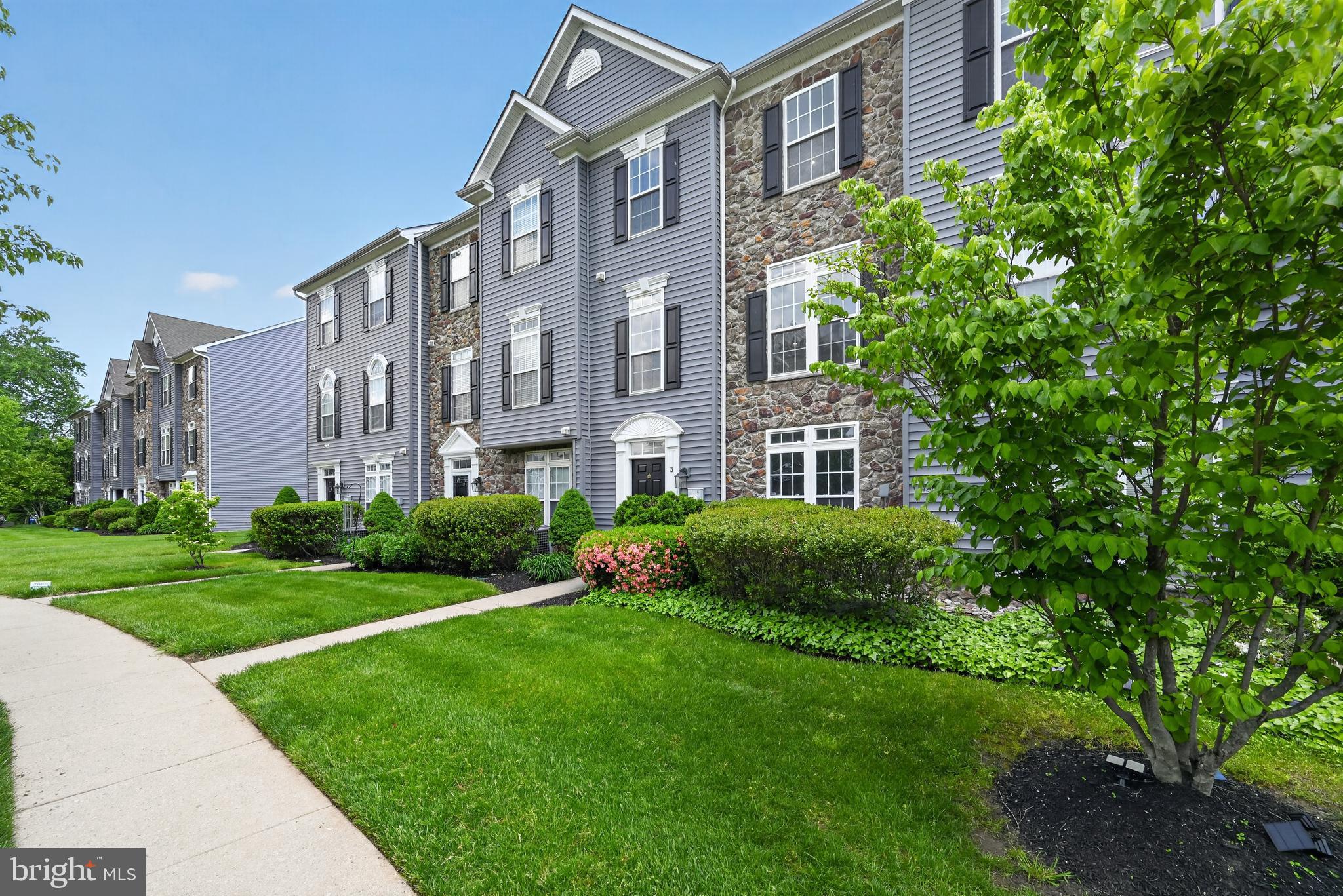 3 Swan Court Delran, NJ 08075 - Photo 2 of 34 a view of a building next to a big yard and large trees
